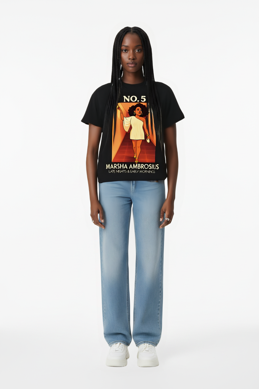 Person wearing a black t-shirt with a graphic design and light blue jeans on a white background